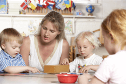 teacher teaching the children on how to read