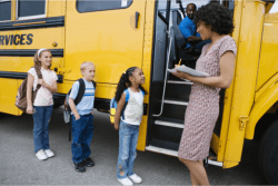 children ready to ride a school bus